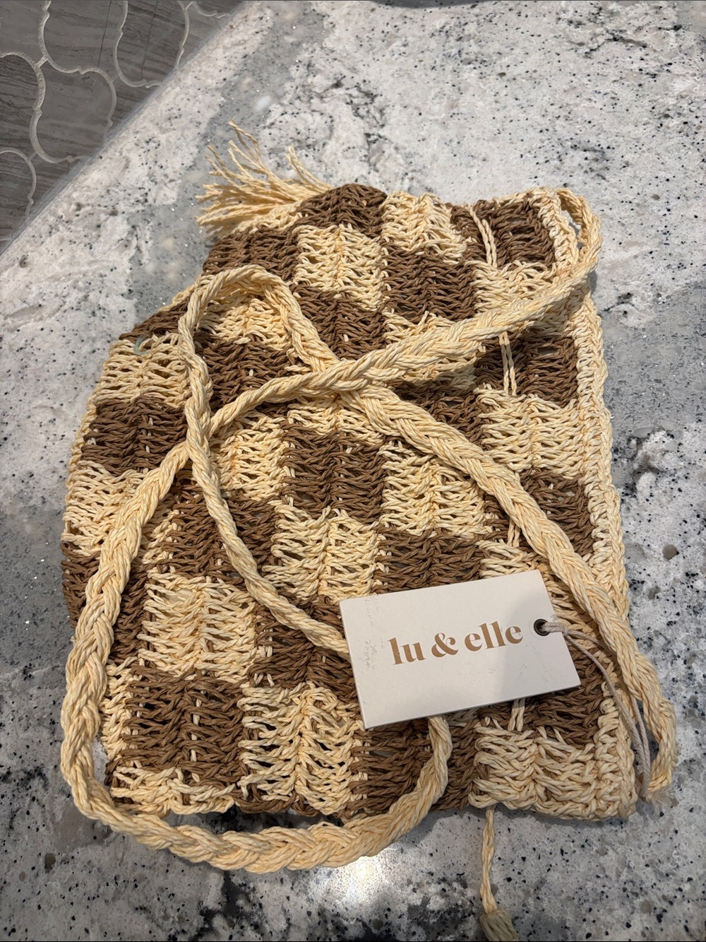 Lu & Elle Two-Tone Woven Drawstring Crossbody Bag in Cream and Brown